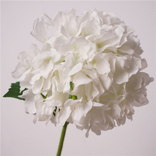 Close up view of white faux hydrangea faux flowers for indoor farmhouse home decoration
