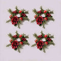 4 pack burgundy dahlia Christmas candle rings with red apples, berries and evergreen foliage on light grey background, no candle included