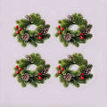 4 pack Christmas pine candle rings with red berries and frosted pinecones, product flat lay on light grey background
