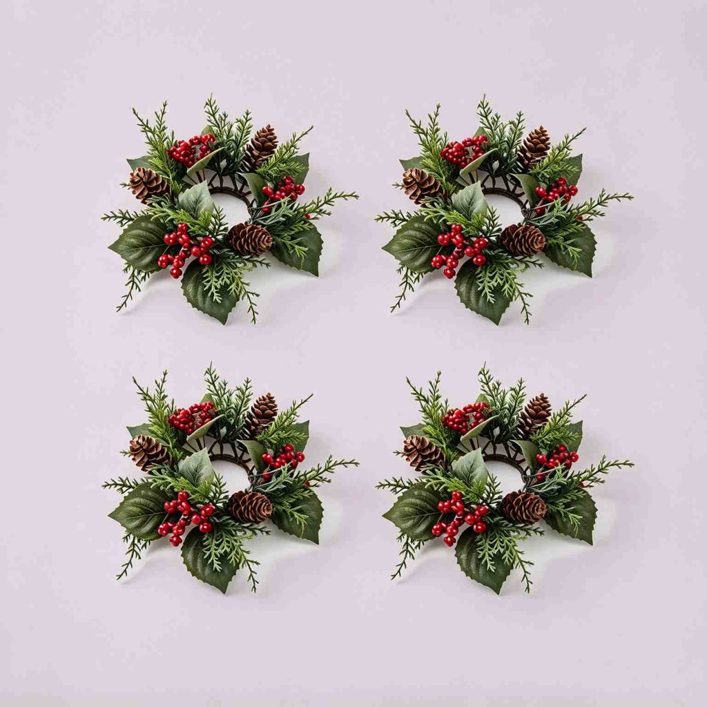 4 pack artificial pinecone red berry Christmas candle rings, flat lay product display on light grey background