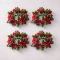 4 pack christmas candle ring wreath with red poinsettia, red berries and frosted pine cones, flat lay product display
