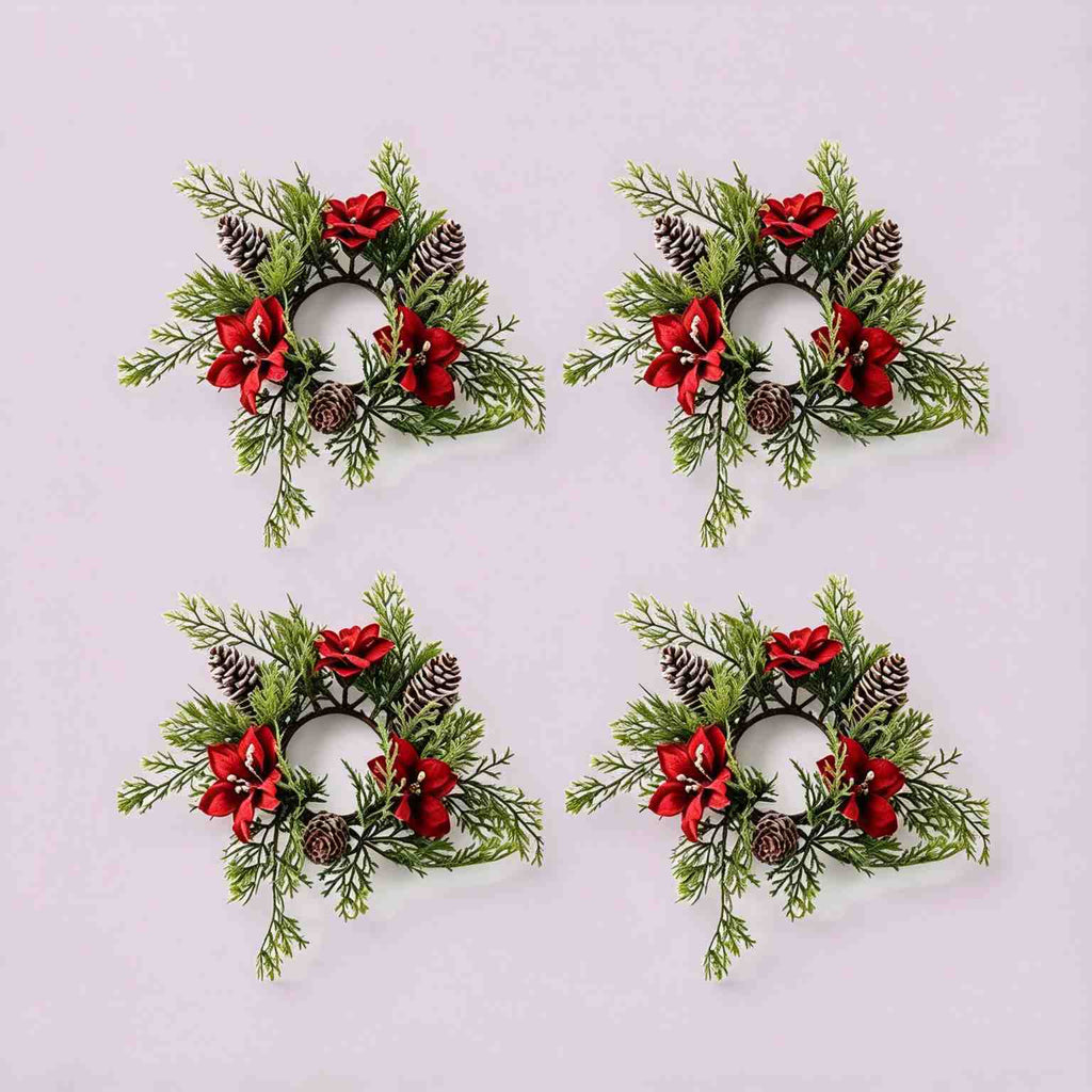 4 pack artificial Christmas candle rings with red poinsettia blooms, frosted pinecones and cypress greenery, product shot on light grey background