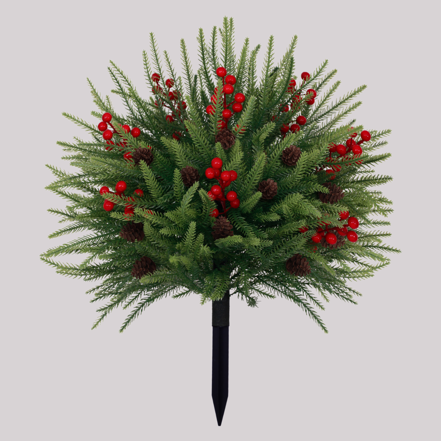 64cm bushy artificial christmas tree decorated with red berry sprigs and natural brown pinecones