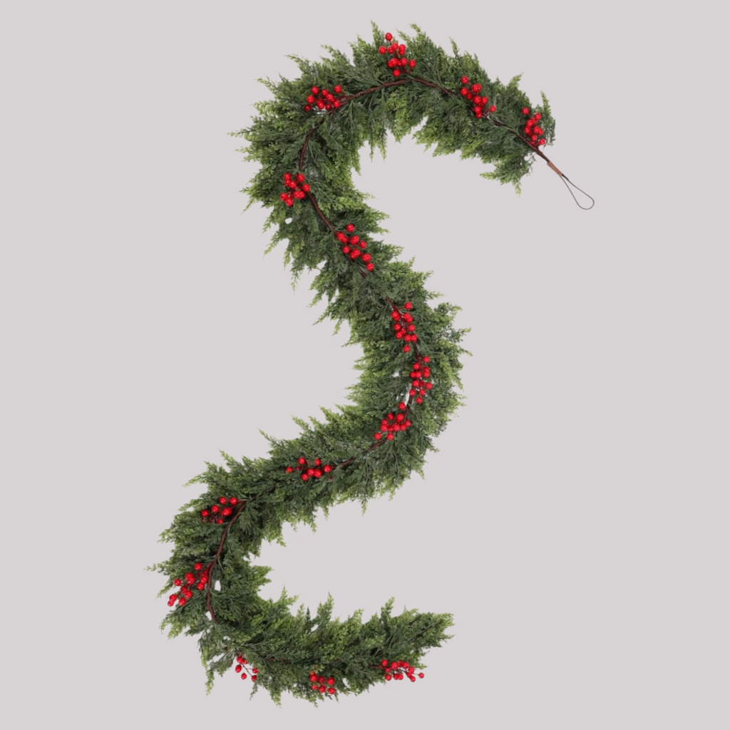 9 foot S-shaped red berry Norfolk Pine Garland isolated on plain background bendable artificial Christmas greenery