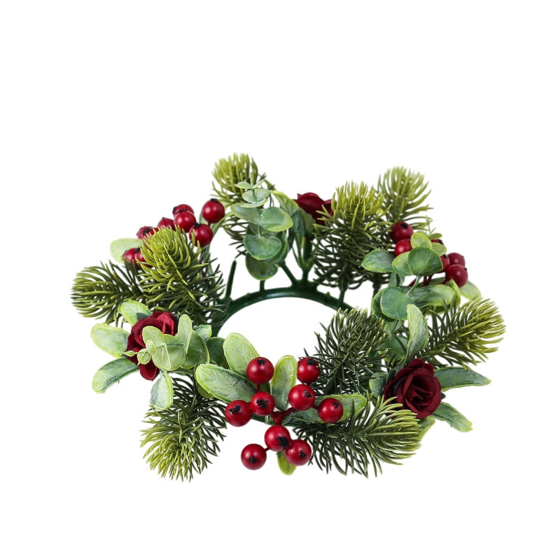 Empty christmas candle ring wreath featuring burgundy roses, bright red berries, eucalyptus leaves and pine sprigs, white isolated background