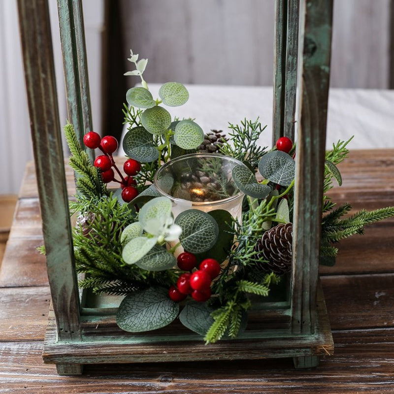 Eucalyptus pinecone red berry candle ring with glass tealight candle inside distressed green wooden lantern