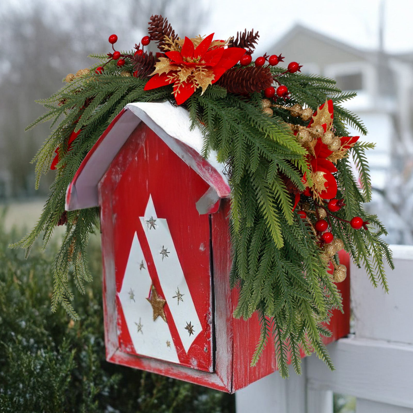 Traditional bendable pine christmas wreath accented with poinsettia pinecones for outdoor mailbox decor