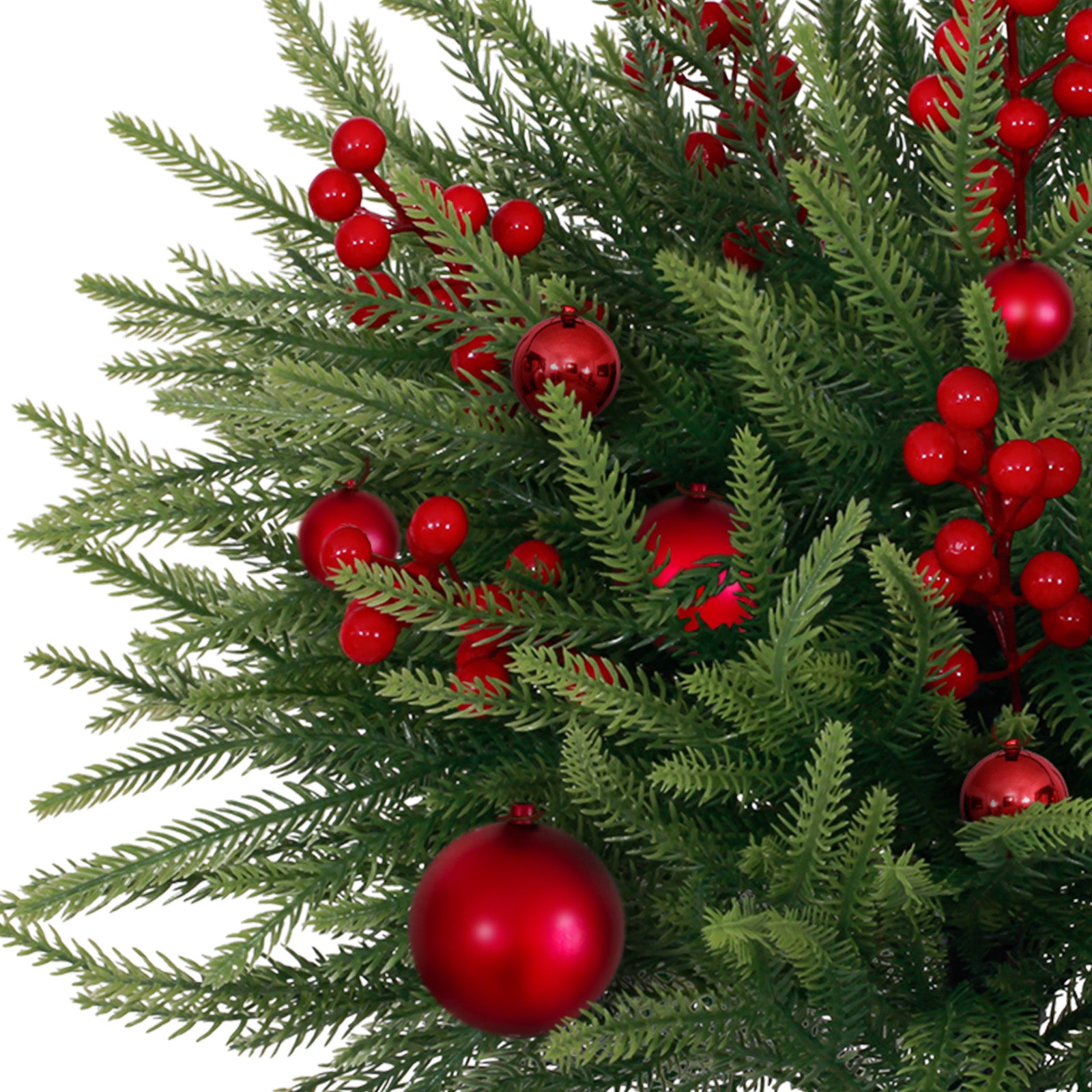 Full lush decorated best artificial christmas tree with vivid red baubles and berry clusters for holiday curb decor