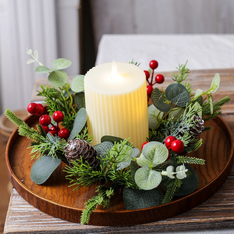 Eucalyptus pinecone red berry candle ring with flickering pillar candle for rustic Christmas table centerpiece decor