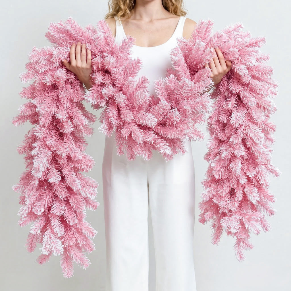 Extra fluffy flocked pink pine artificial christmas garland hand held to show thick realistic branch texture