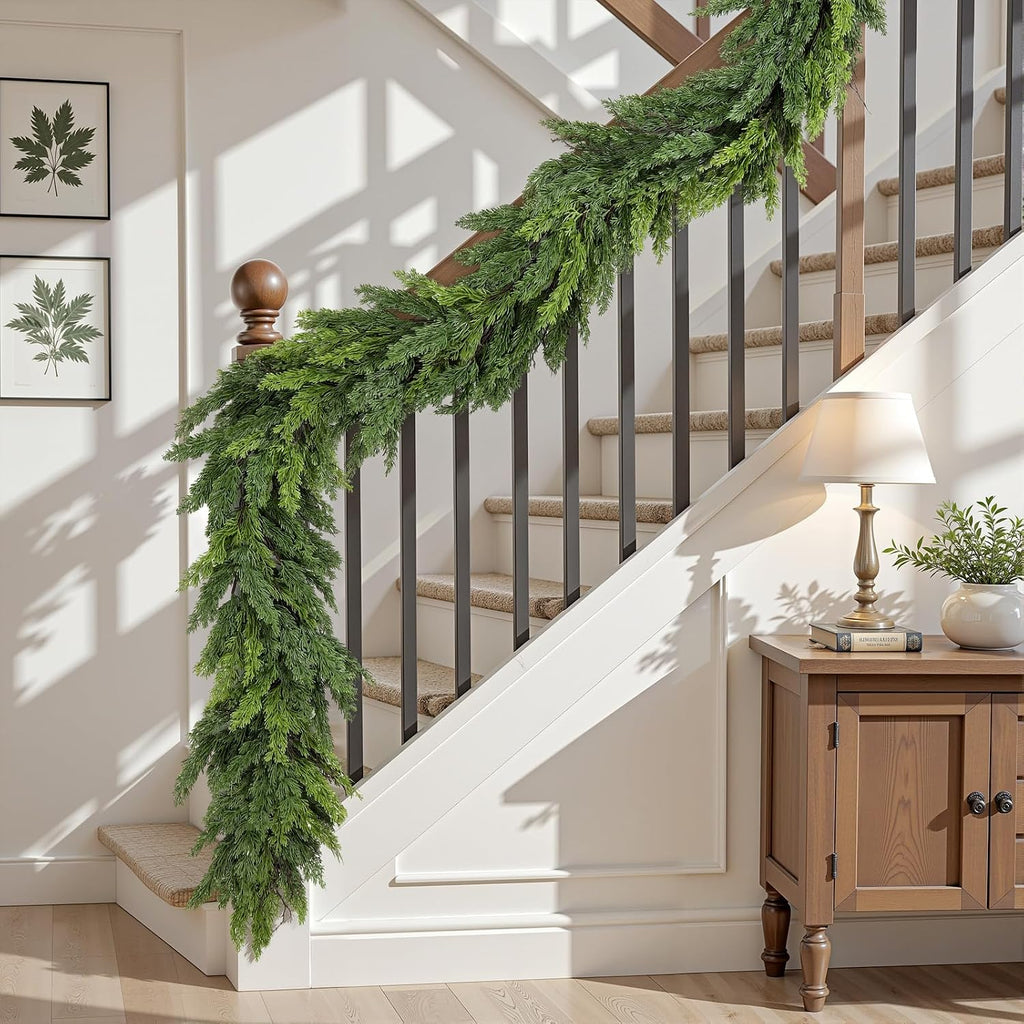 Full length lush cedar christmas garlands draped over black metal stair spindles modern farmhouse holiday decor