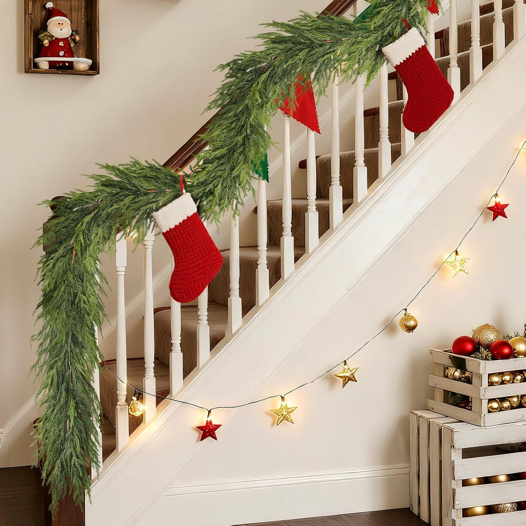 Soft texture Norfolk Pine Garland draped on white staircase with red knit stockings & star fairy lights