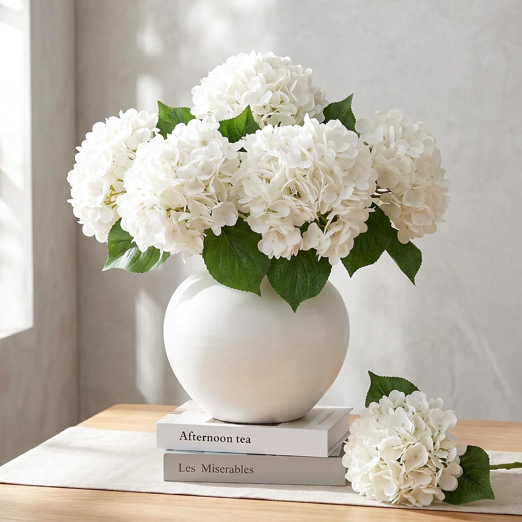Voluminous full bloom white hydrangea faux flowers bush paired with extra flower head for neutral tabletop decor