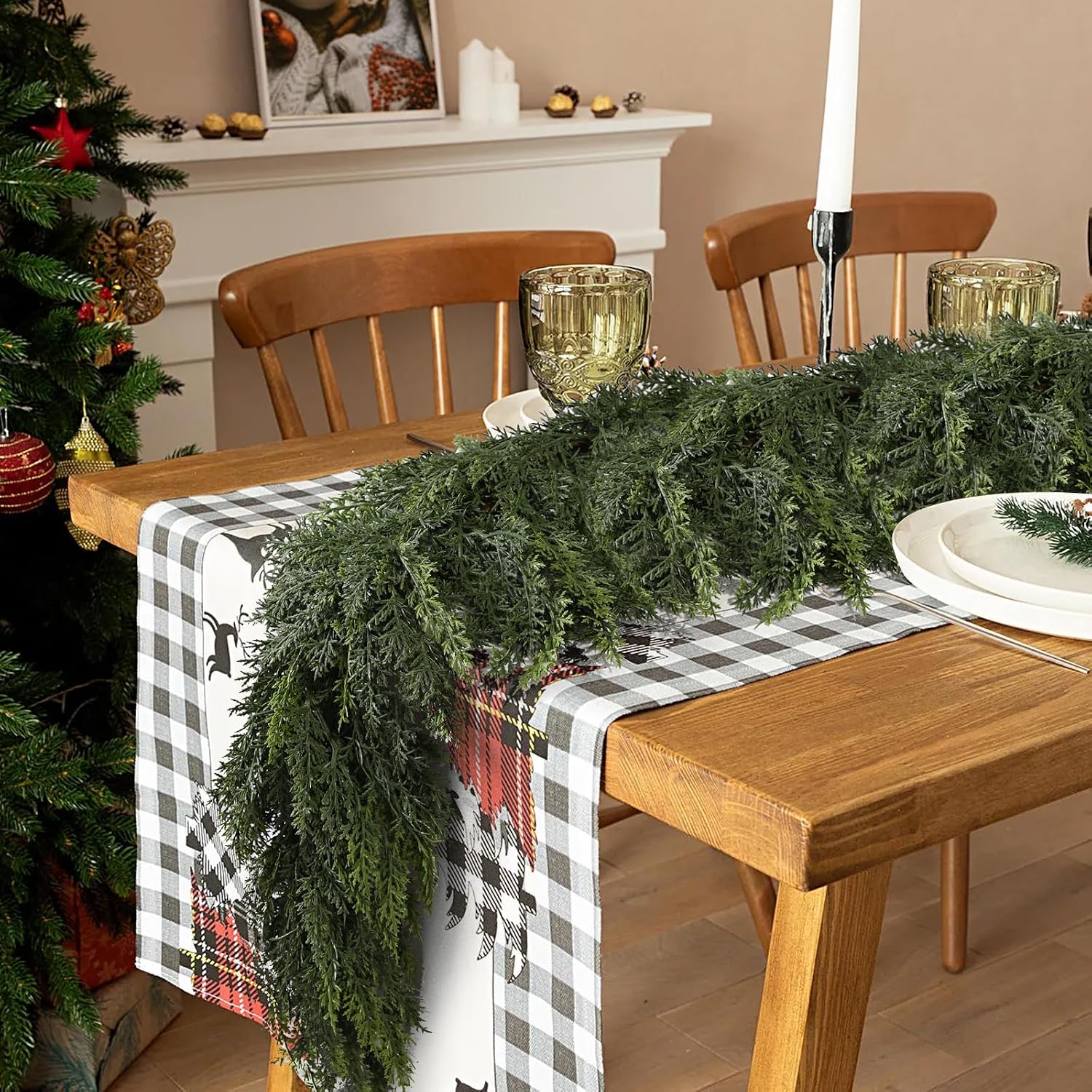 Lush textured cedar faux xmas garland paired with buffalo check table runner for rustic cabin holiday table styling