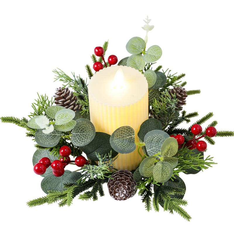 Isolated Christmas candle ring with eucalyptus, pine cones, red berries and ribbed LED pillar candle on plain white background